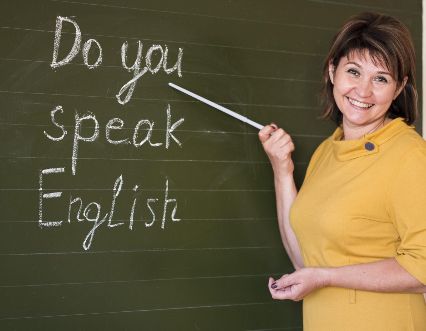 smiley-teacher-explaining-chalkboard